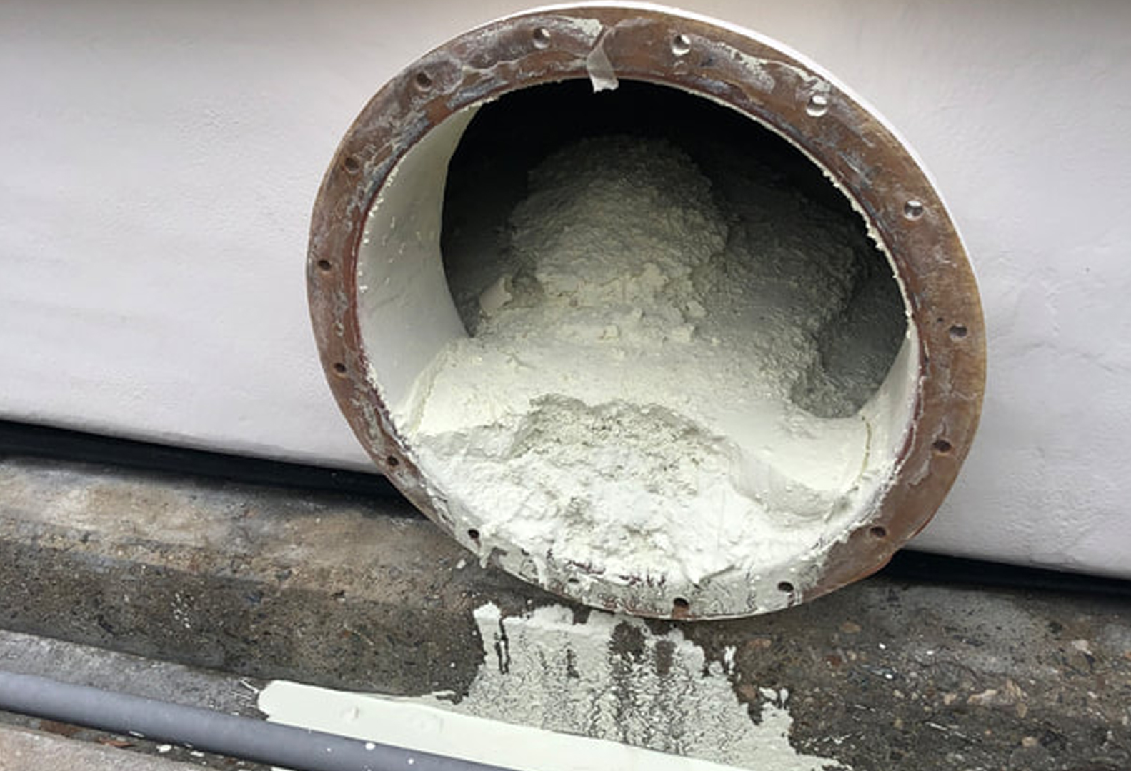 Buildup accumulation at bottom of scrubber after cleaning