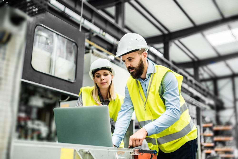 engineers in yellow vests for web AdobeStock_223338190